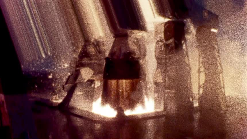 Vintage footage of rocket launch with refractive grating filter creating prism like shape