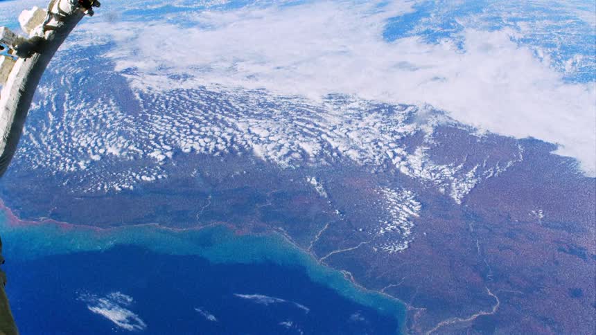 Distorted footage of land masses on planet earth seen from the international space station
