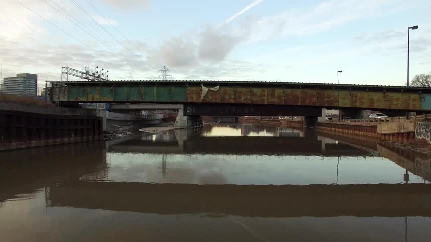 Moving across a canal with moving cars on either side