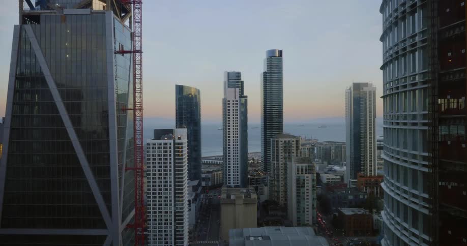 The city is line with tall buildings at sunset