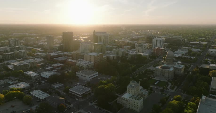 Aerial view of high rise buildings and downtown area at sunset in the city