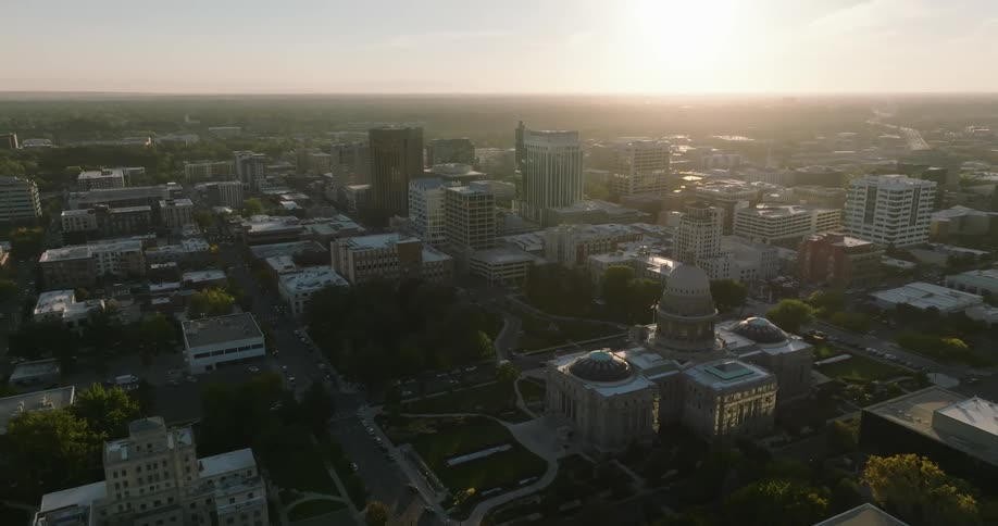 Aerial view of a downtown city while sun is setting