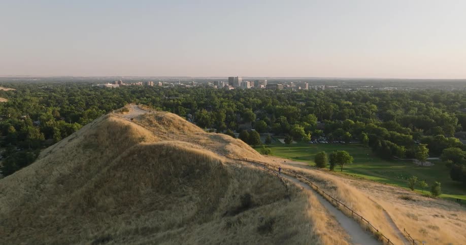 Past the mountains and forest are a city