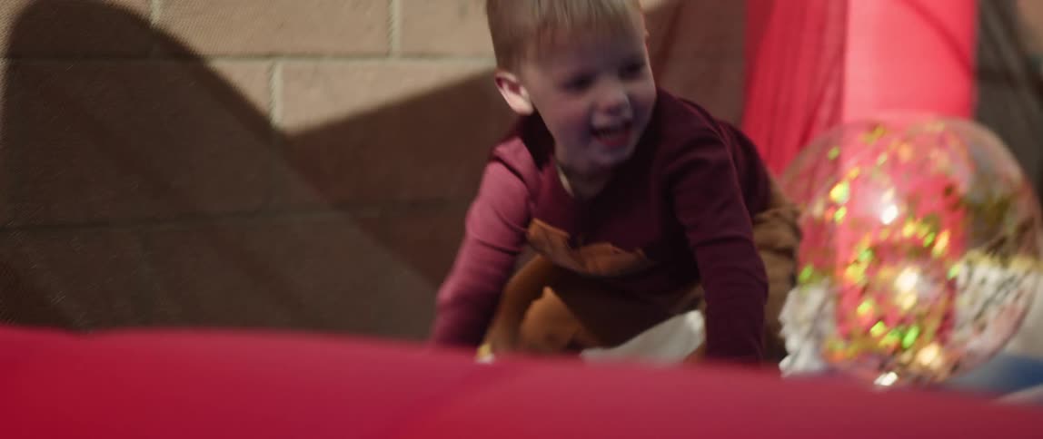 Toddlers are outdoors and are playing outside in the day time