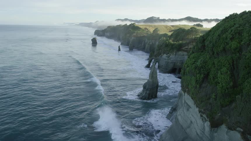 Waves crash against the shore