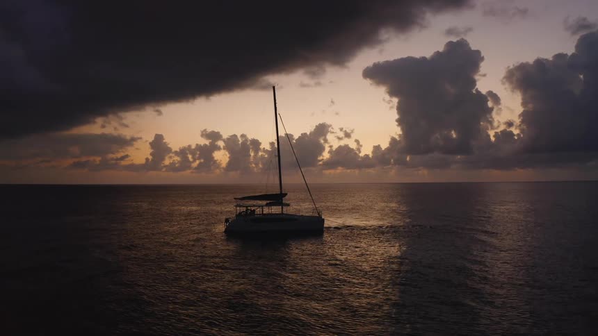 Storm clouds are over the anchored boat