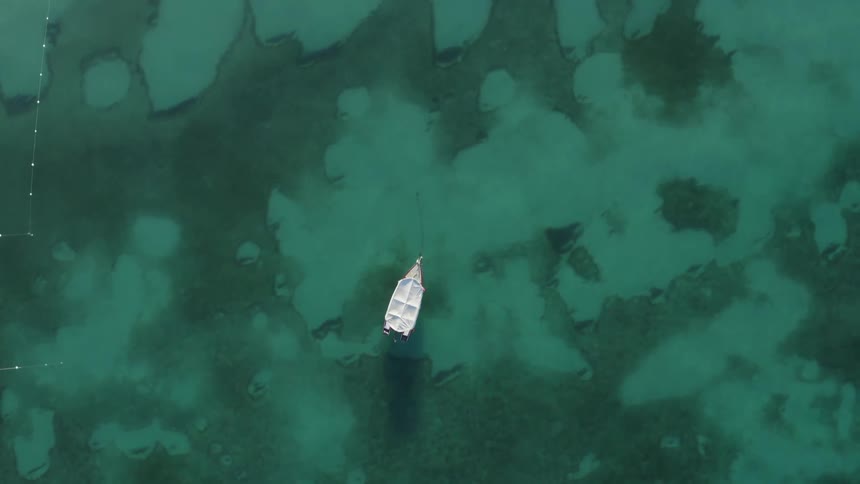 A small boat is in the water