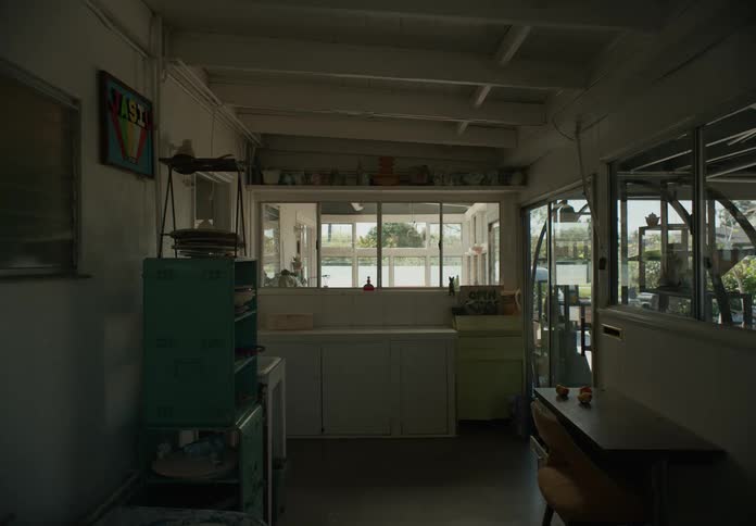 A room inside of a home contains multiple pieces of furniture