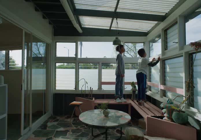 Two children are playing at home