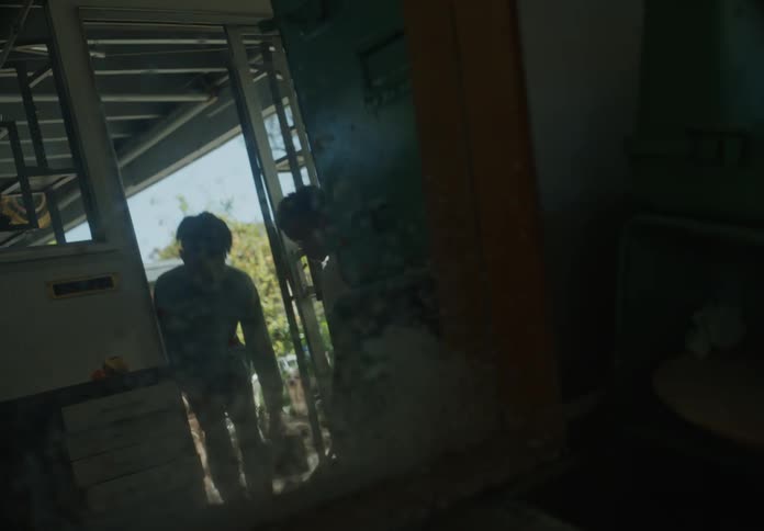 Two children are digging by the doorway