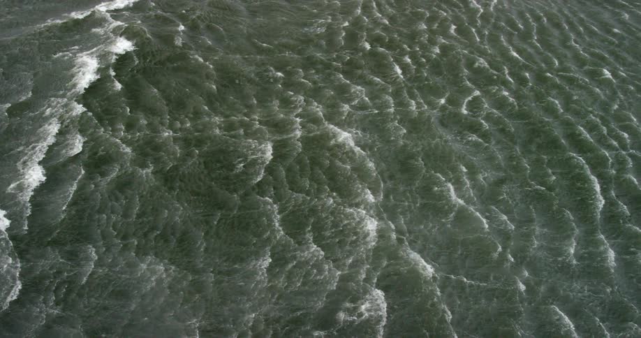Wind is blowing the water into waves below