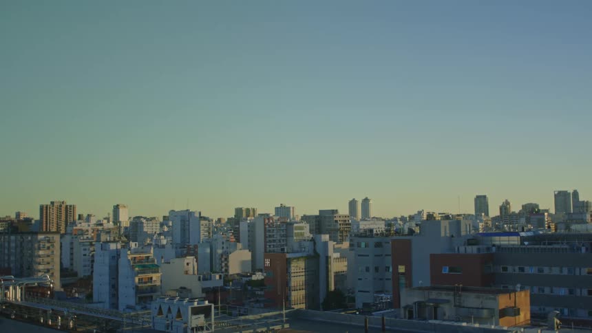Aerial view of a downtown city at dusk is displayed