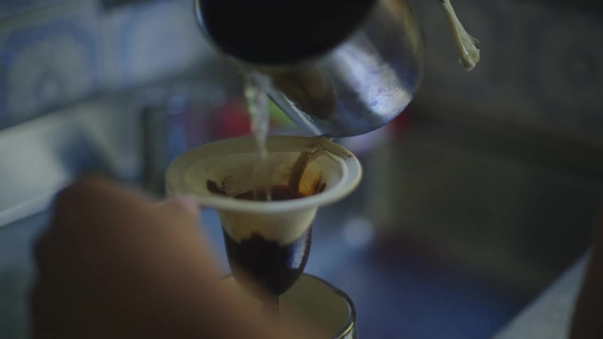 A person is pouring a drink