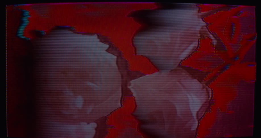 Flat maroon objects move as the organic red surface below glows and ripples