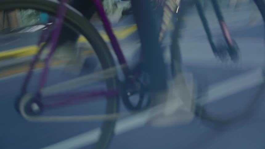 Mans feet pedaling on a bicycle lower fps choppy and motion blur