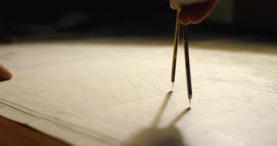 A compass is being used on a map