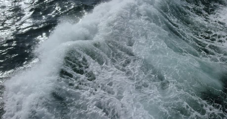 Large waves move along the water below