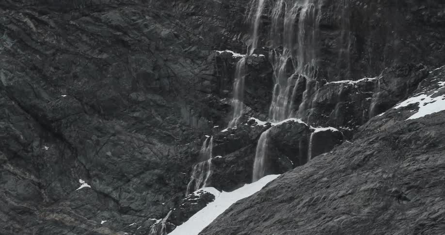 A waterfall on a snowy mountain