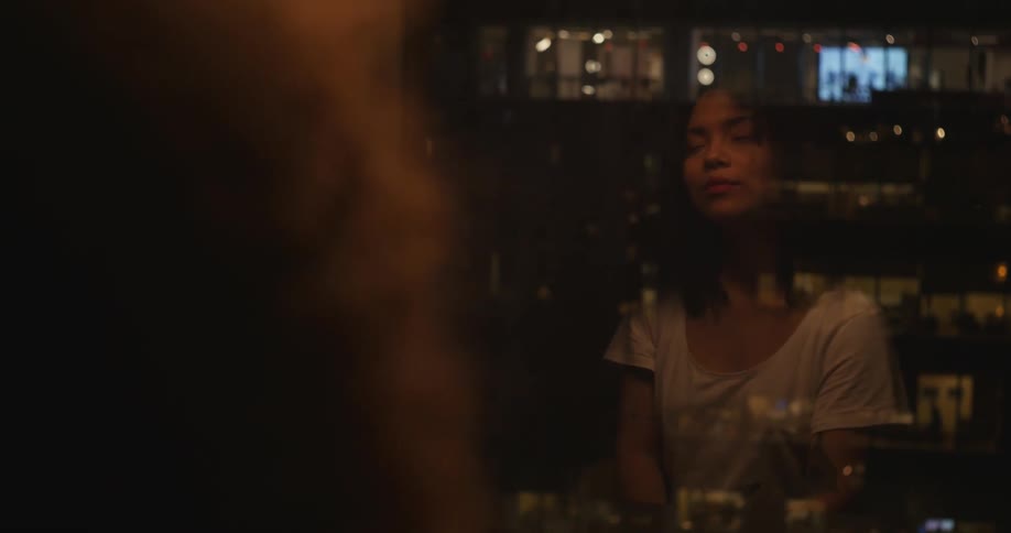 A woman is looking out the window