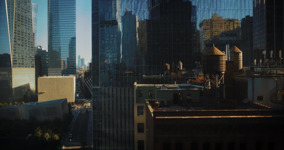 Water tanks on the rooftops of buildings surrounded by skyscrapers in new york city
