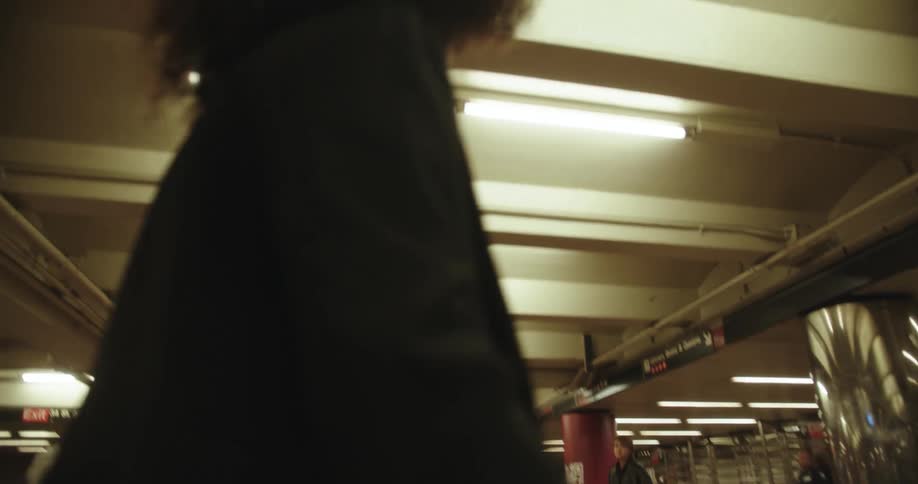 A man and woman dancing at a train station