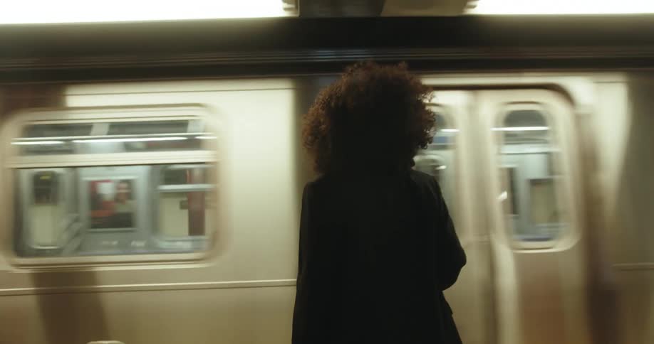 A woman is waiting for the train
