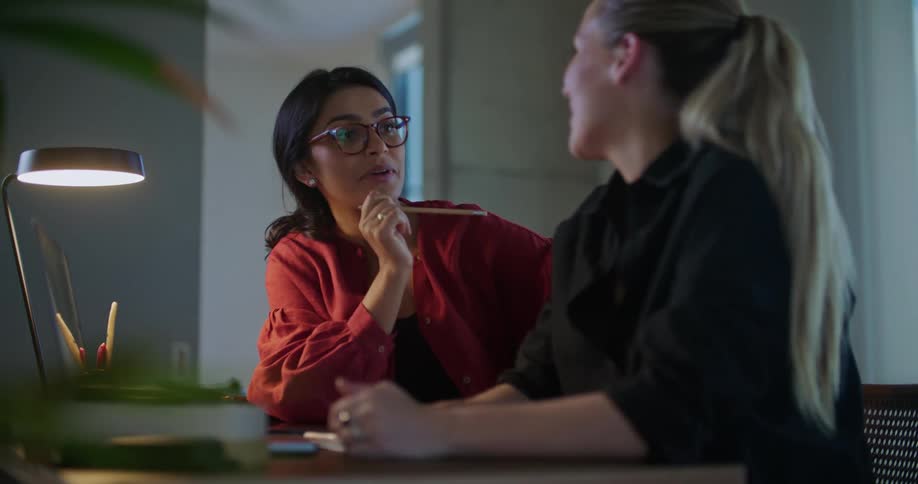 Two women are talking together