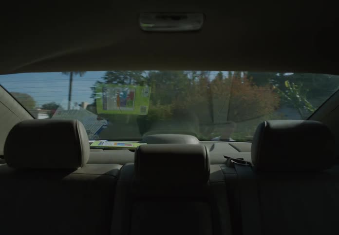 Children chase the car pulling away