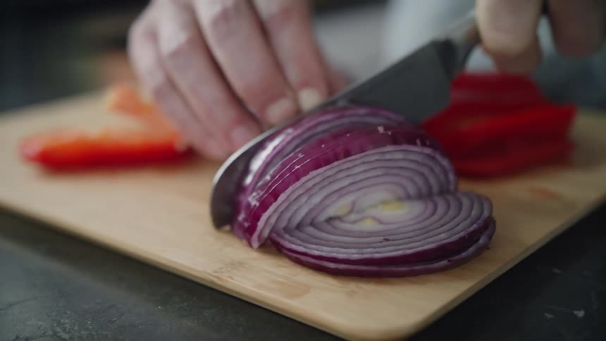 A person is cutting up vegetables