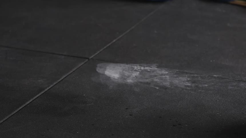 A woman is working out in a building indoors