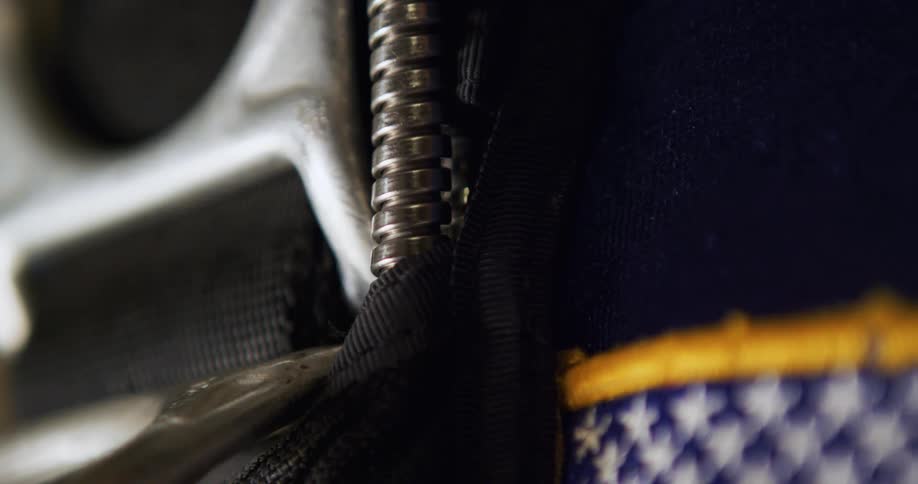 A buckle strap cord and bit of a flag patch maybe from a bag or pack
