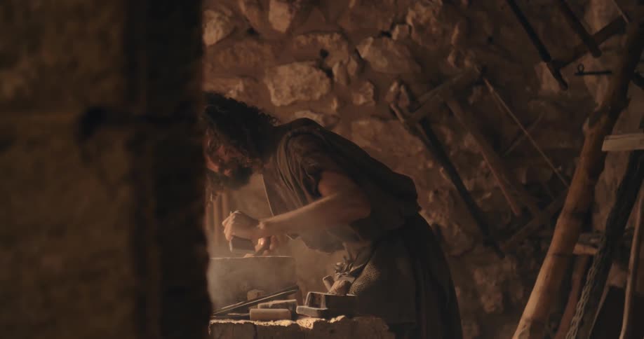 A man is carving stone