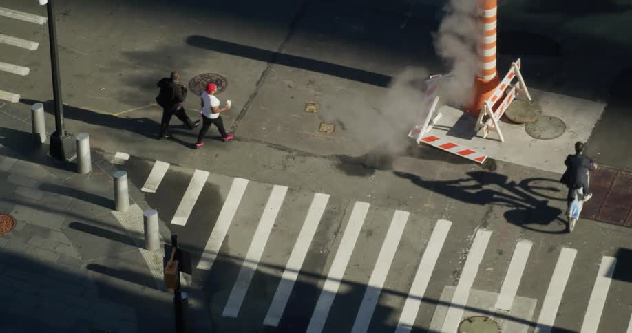 People cross the street in the city