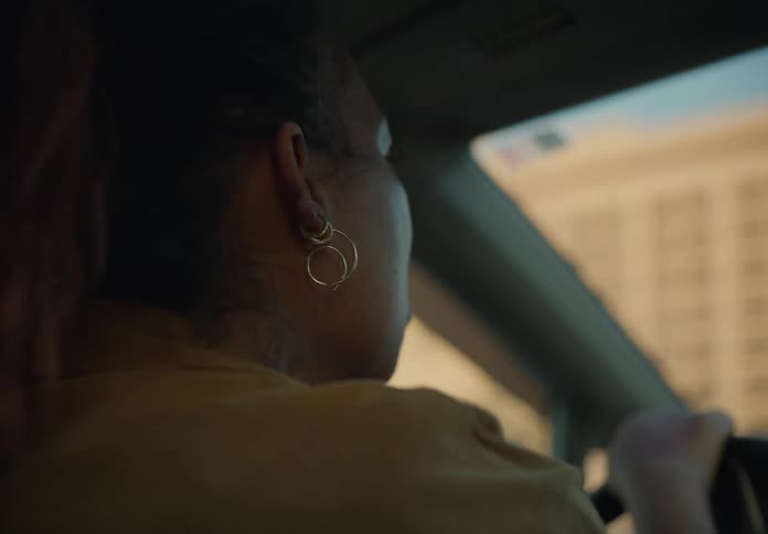 A woman is driving a car