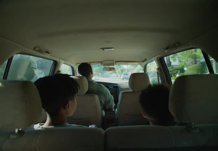 A family are riding in the car
