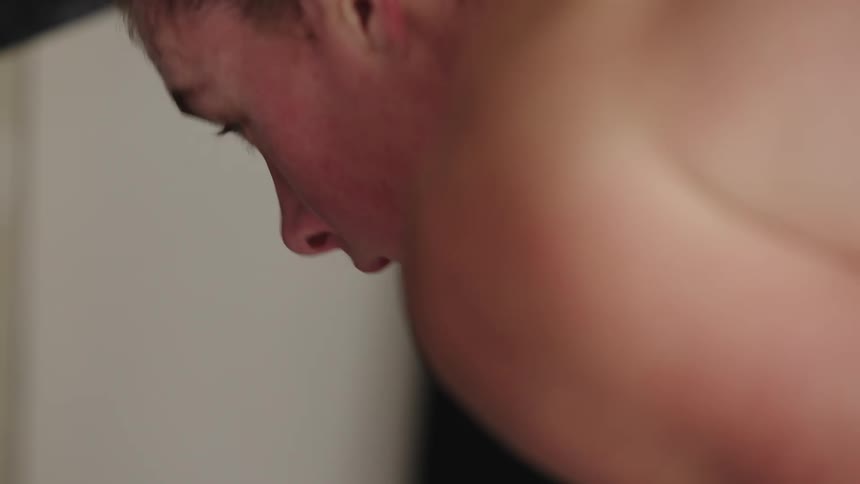Female athlete tired and taking breaths and psyching herself up