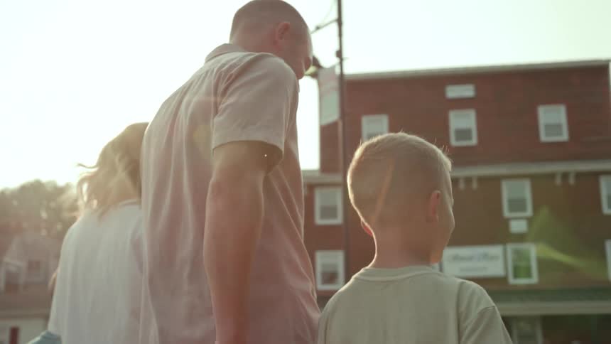 A family walk through town together