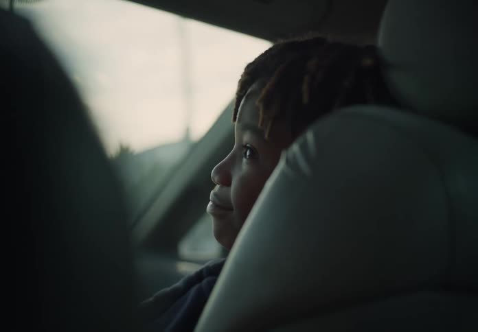 A child is riding in the car
