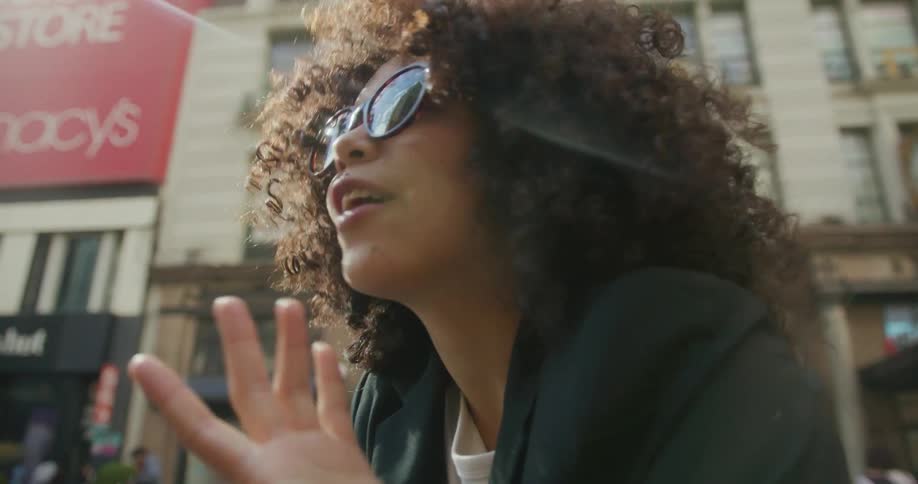 A woman is talking to a man outside