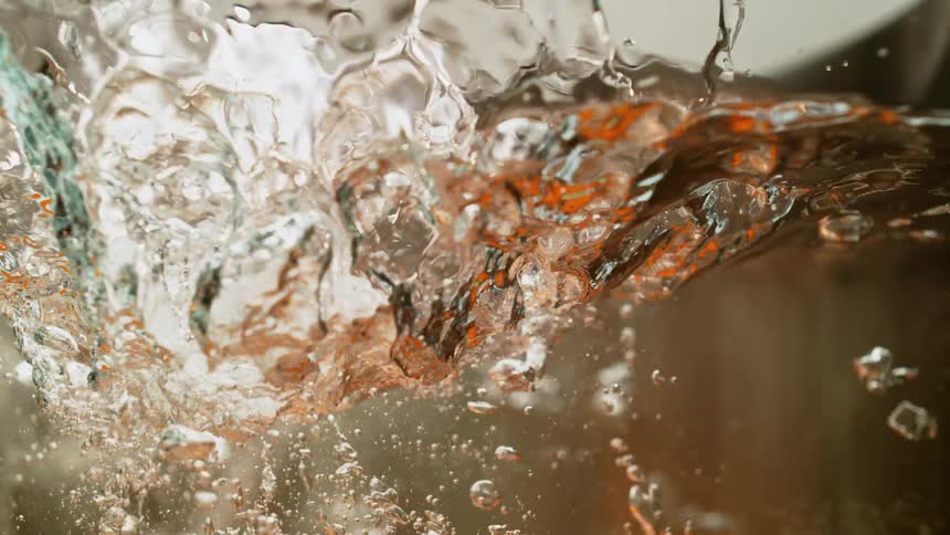Carrots dropped in to water slow motion