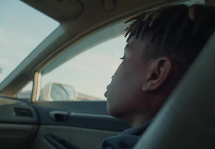 A child is riding in the car