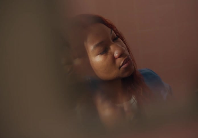 A woman is resting and sitting in a room