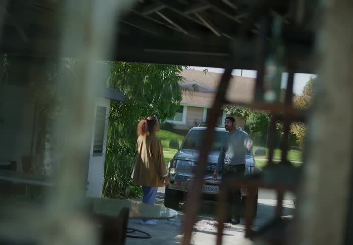 Man comes home from work woman meets him from garage they argue
