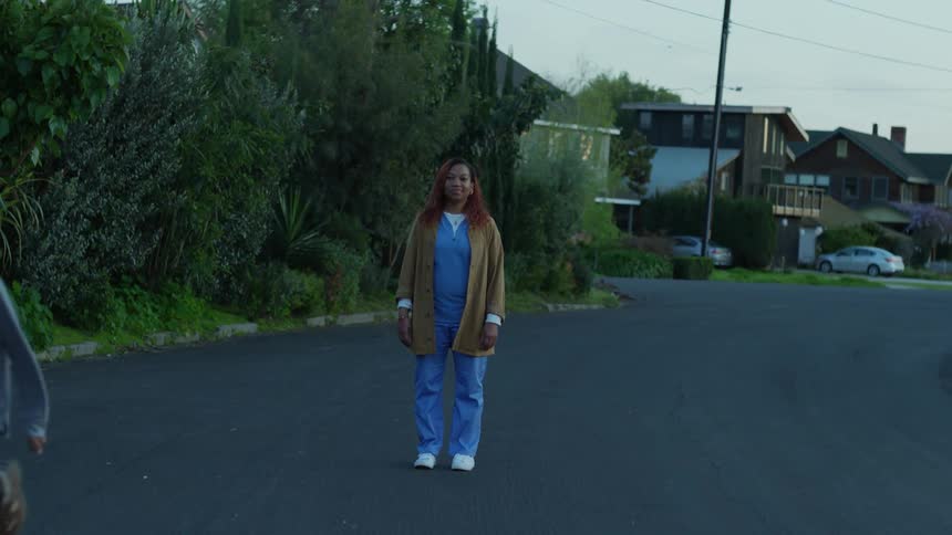 Mother and son hugging while standing out in the neighborhood son starts running down the street
