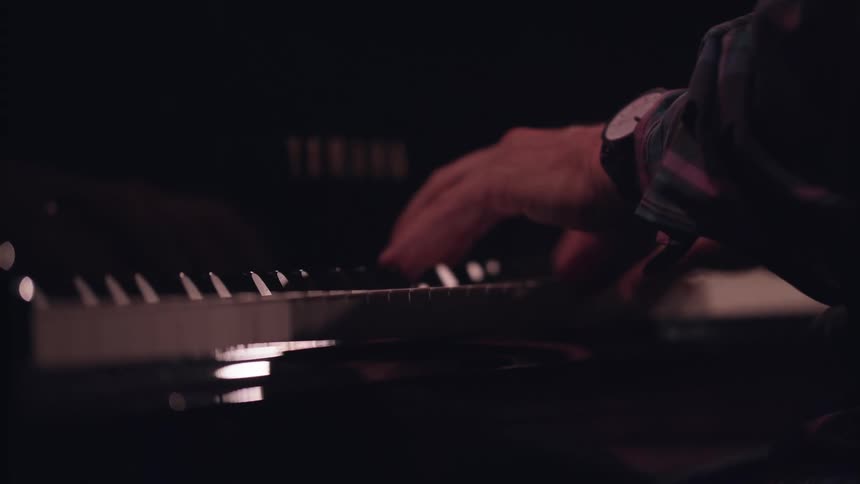 Close up of a person playing the piano