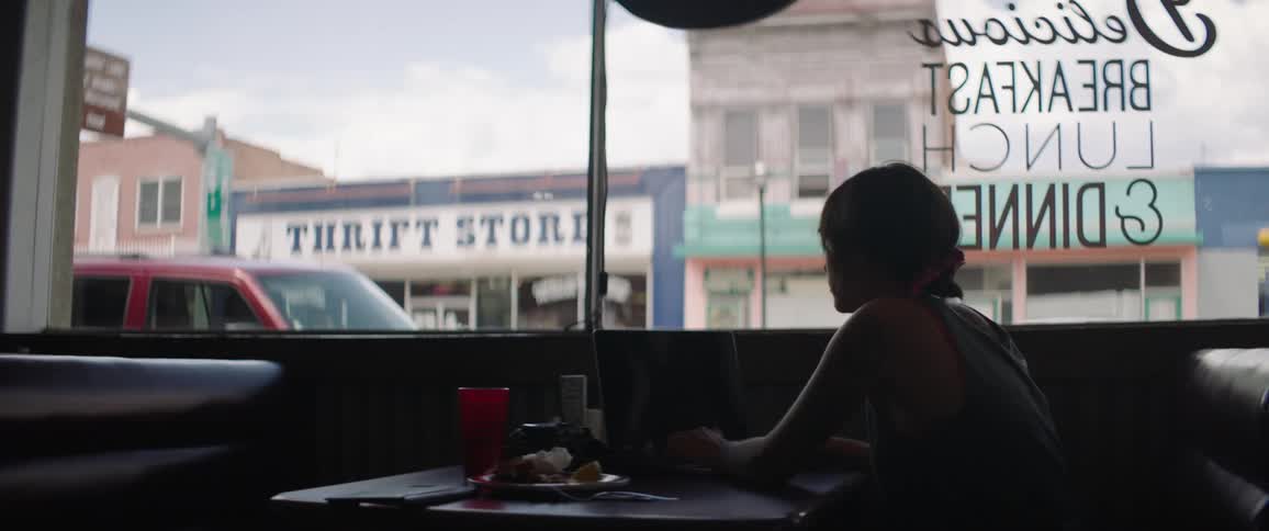 A woman sitting in a restaurant