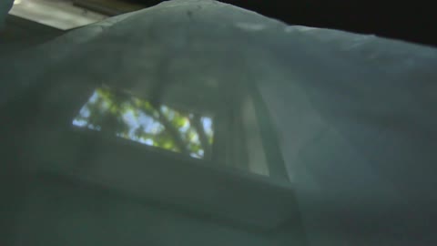 The curtains are blowing on this window