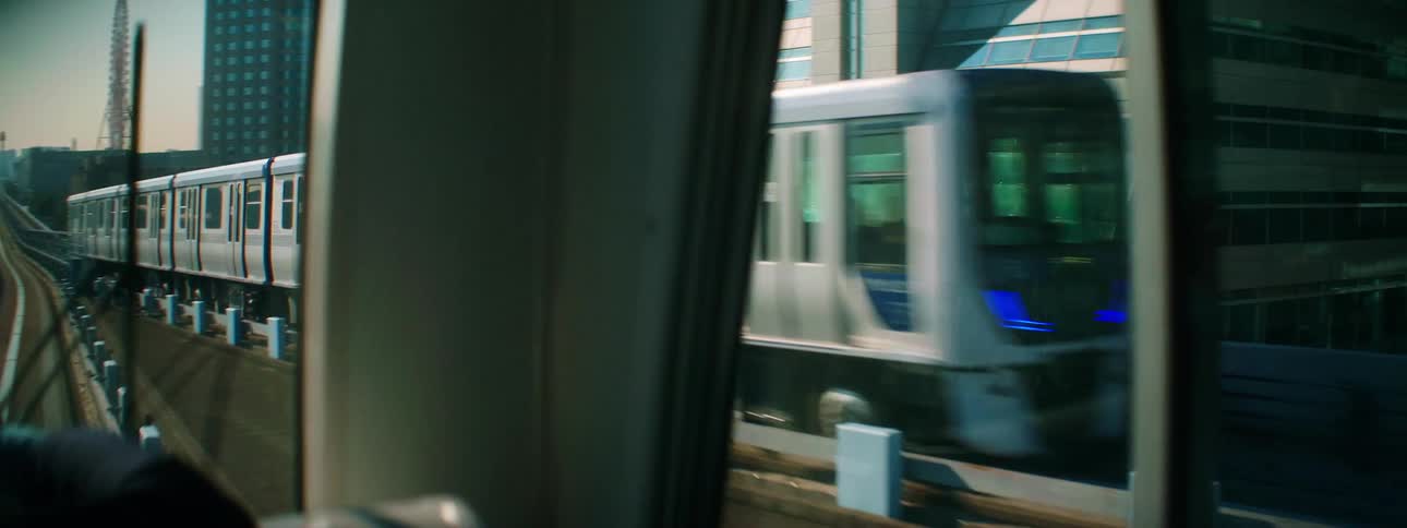 Two trains passing each other on a bridge