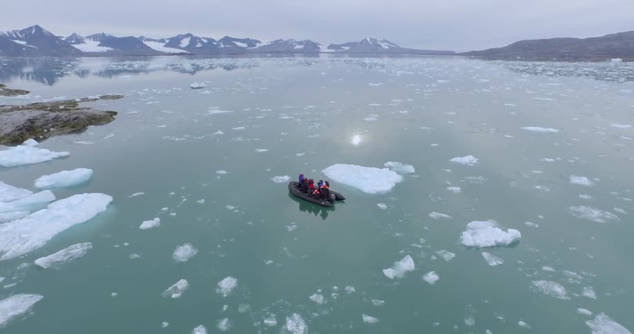 A raft is traveling in icy waters