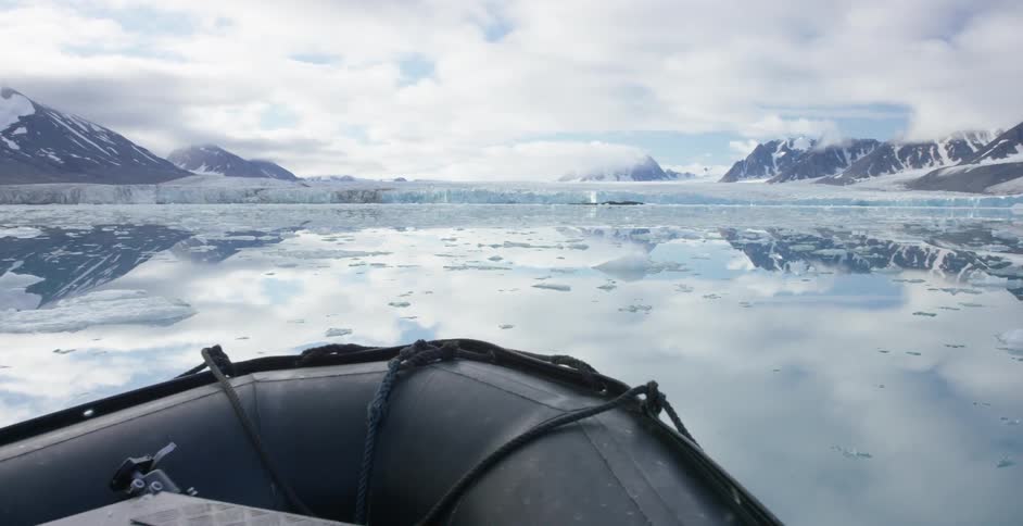 A raft is traveling through icy waters